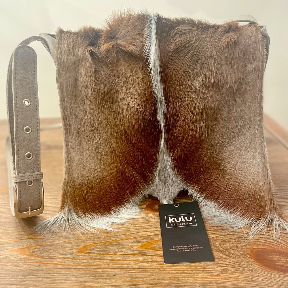 Genuine leather purse with grey and brown Springbok fur. Never worn, tags on.